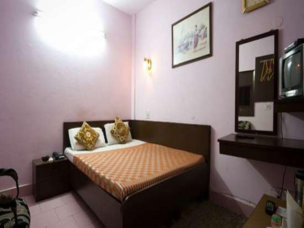 Hotel Woodland Deluxe Új-Delhi Szoba fotó